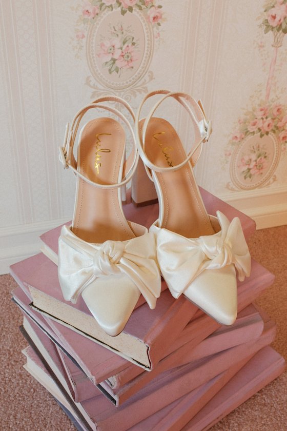 Suttonn Ivory Satin Bow Ankle Strap Pointed-Toe Pumps
